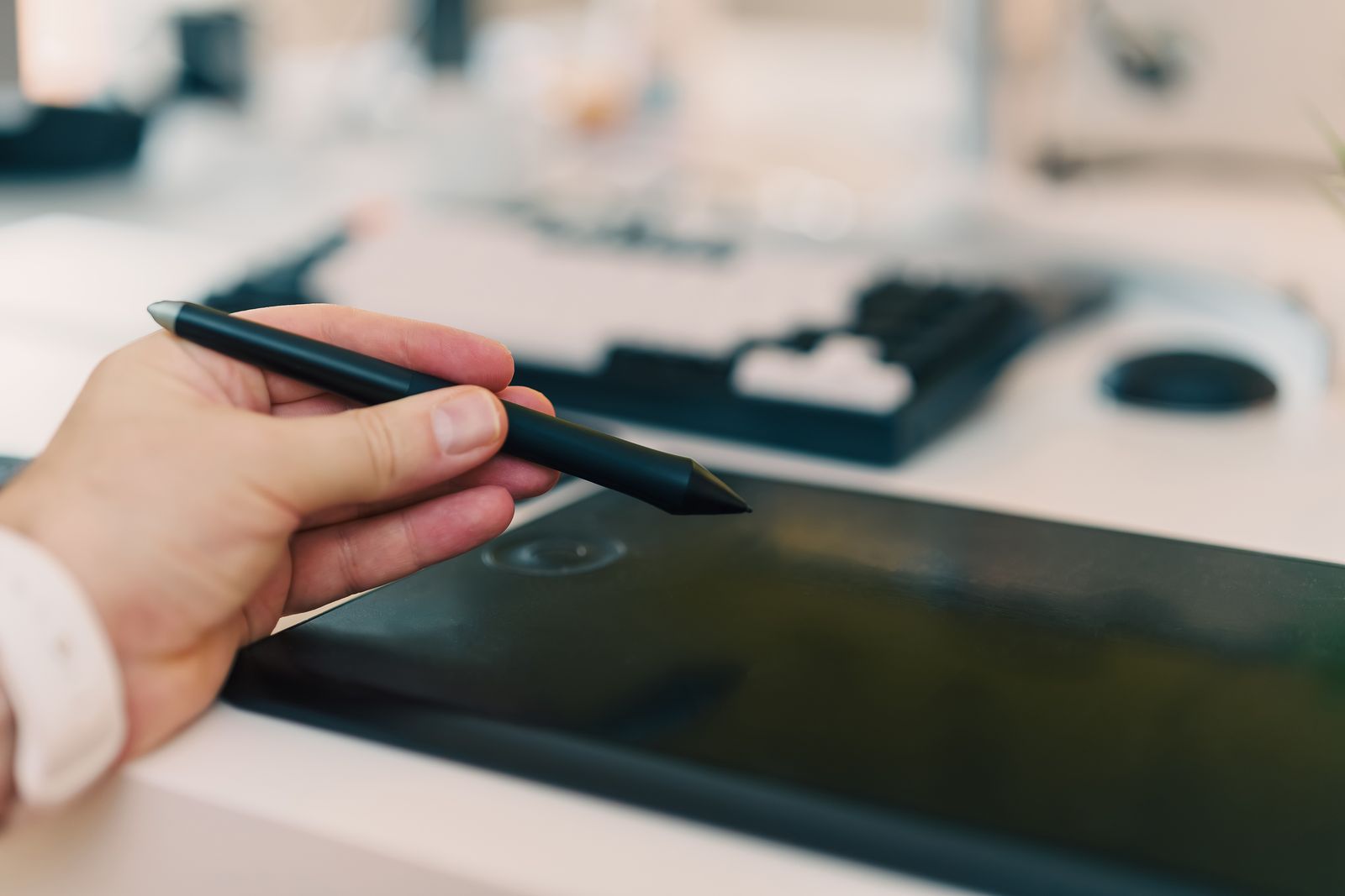 A hand drawing with a stylus on a graphics tablet