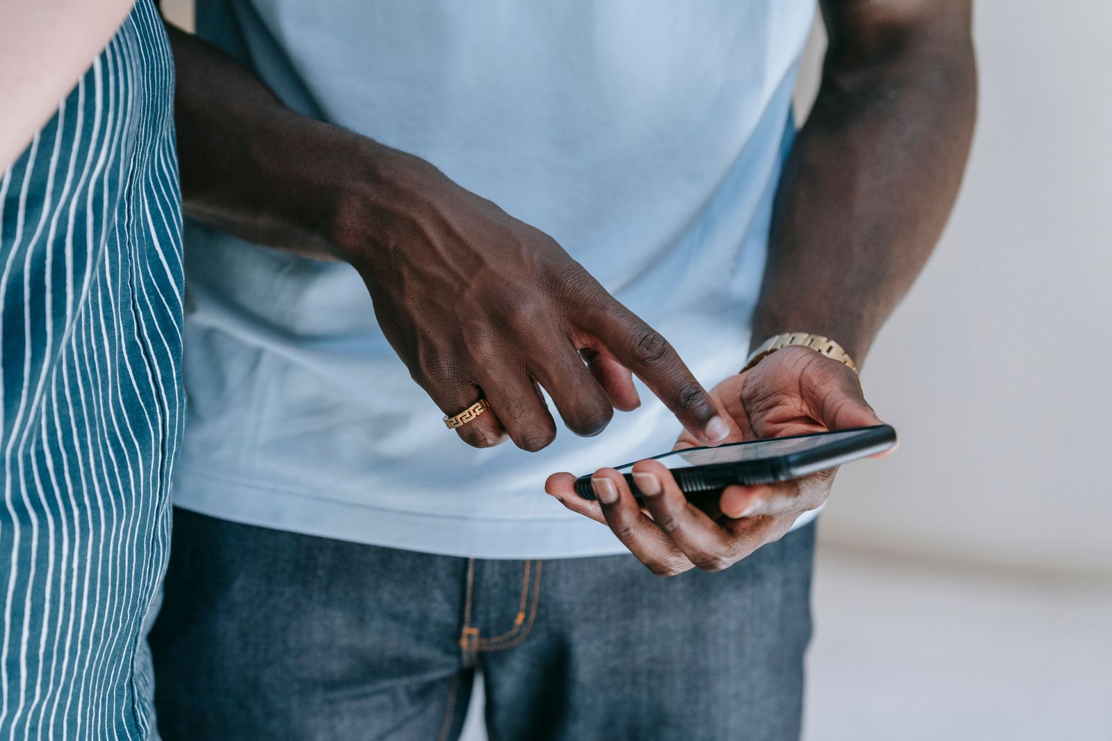 Close view of a person using a smartphone indoors