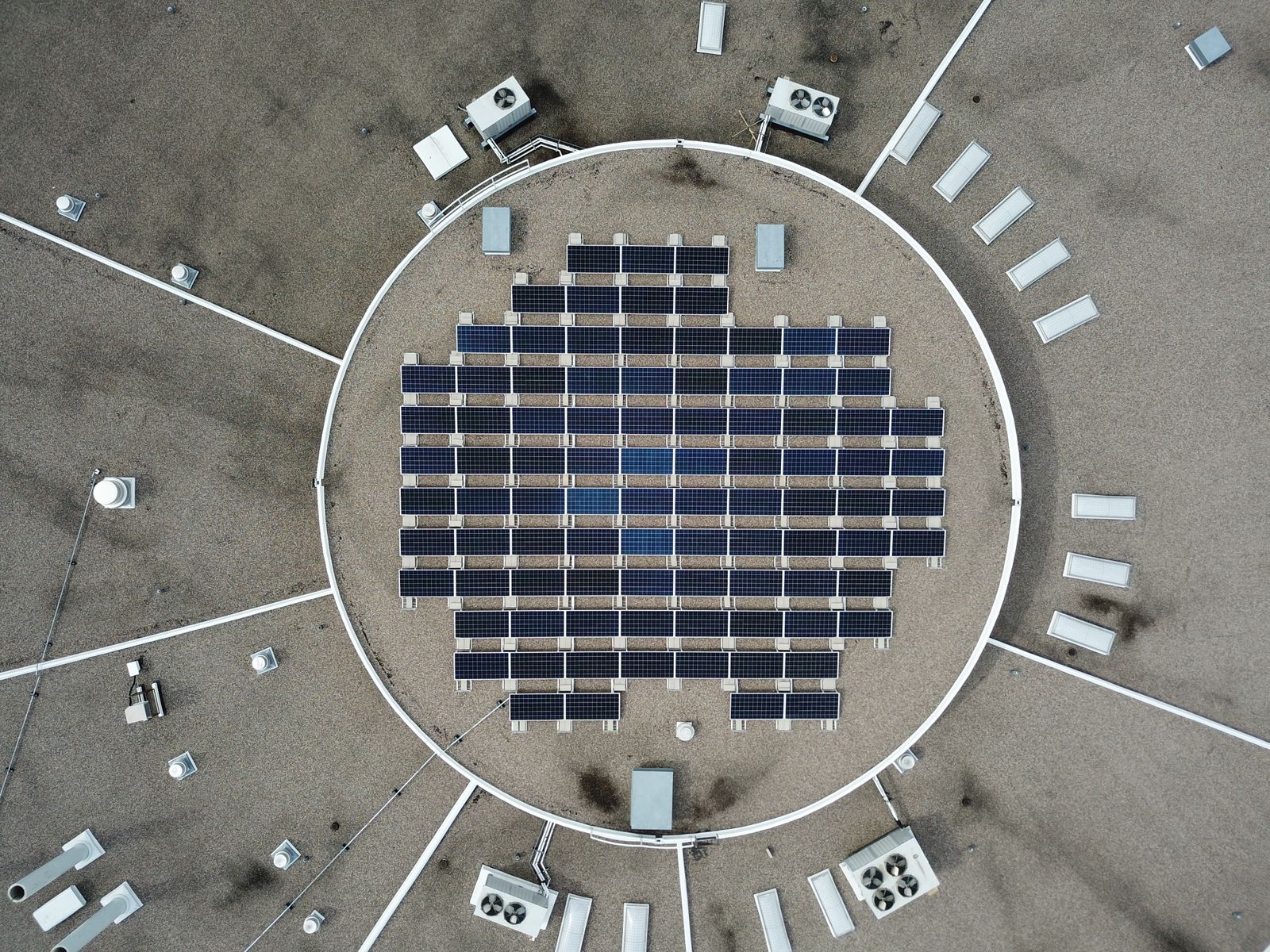 Solar panel array on a round rooftop, seen from above