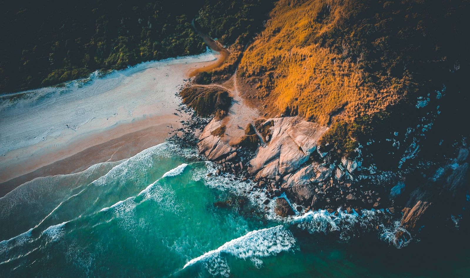 Waves breaking on a rocky coastline, filmed from above