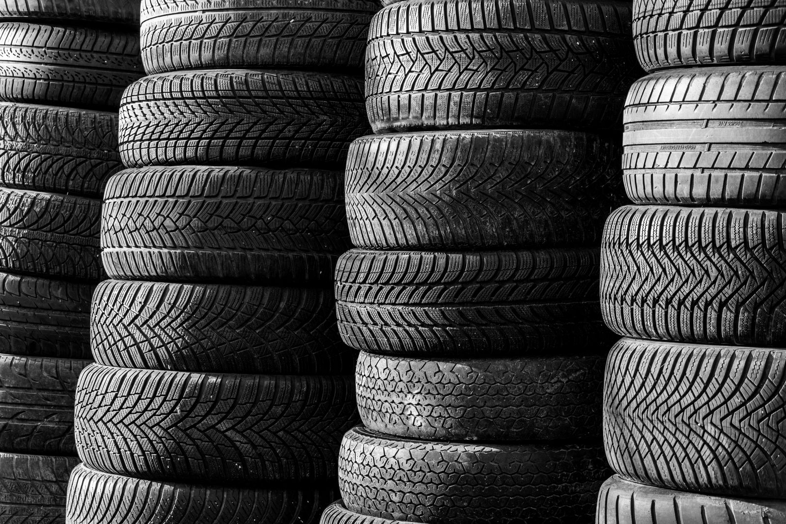 Stacks of car tyres showing their tread patterns
