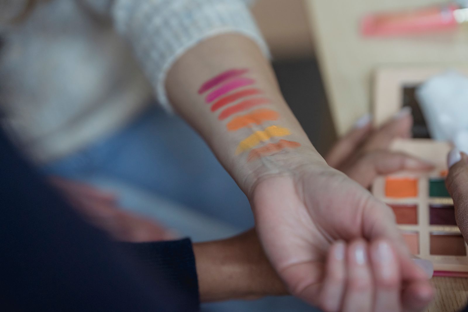 Shade swatches painted on the inside of an arm