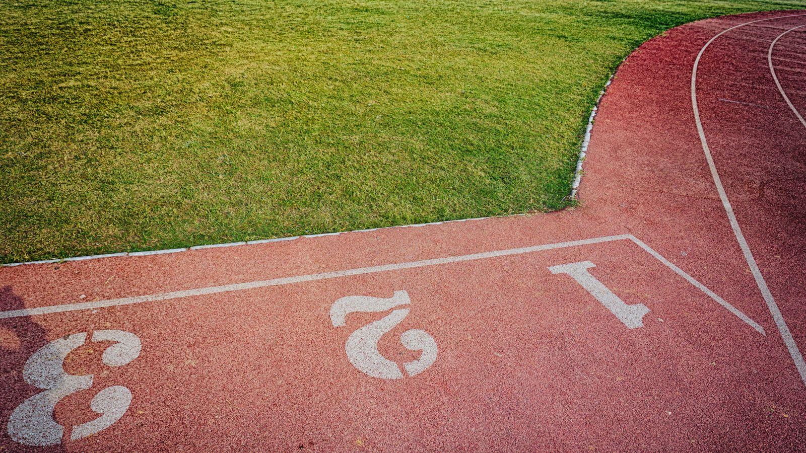 Running track and sports field seen from above
