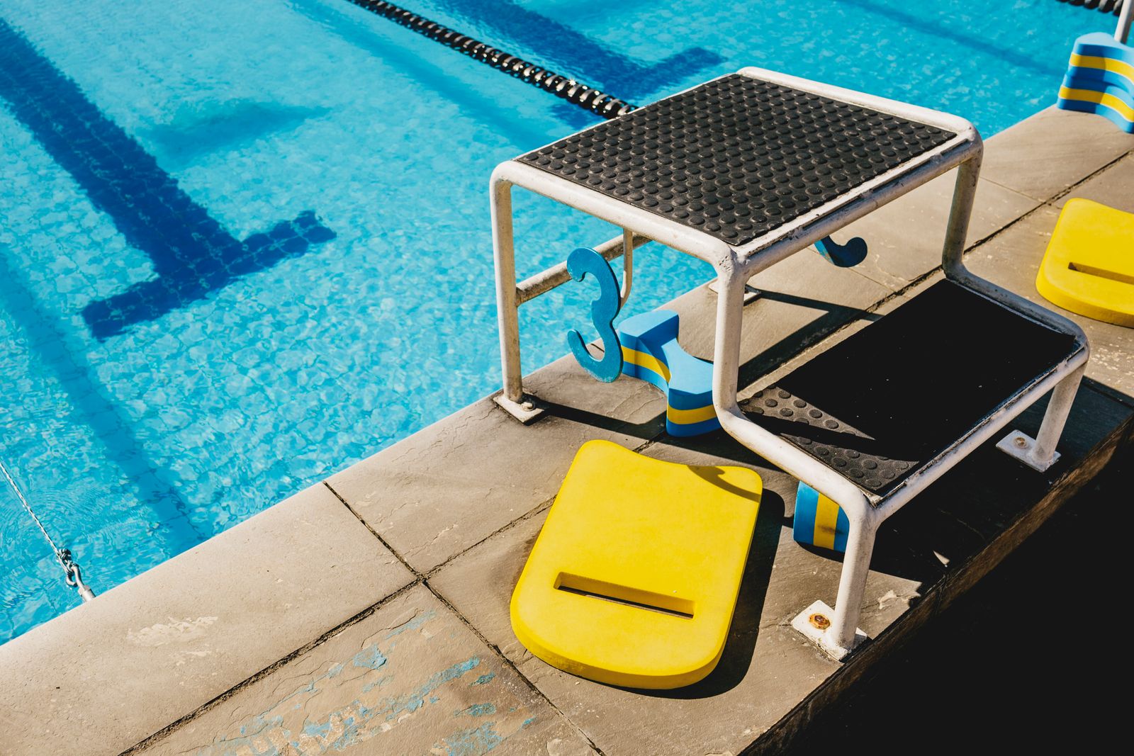 Kickboards stacked by the starting blocks