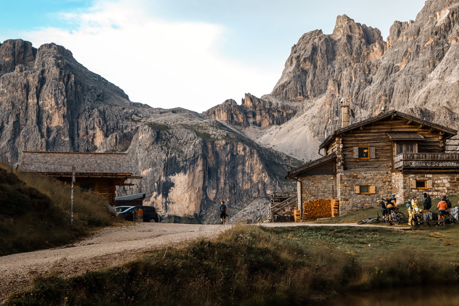 A wooden mountain hut below the Dolomites peaks