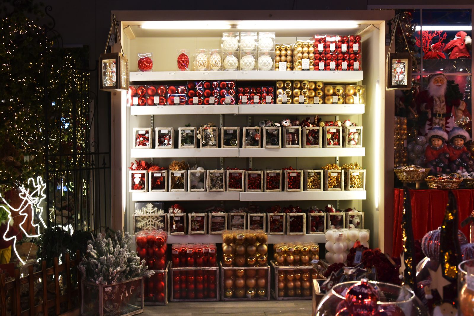 Shelves of Christmas baubles and decorations in a small shop